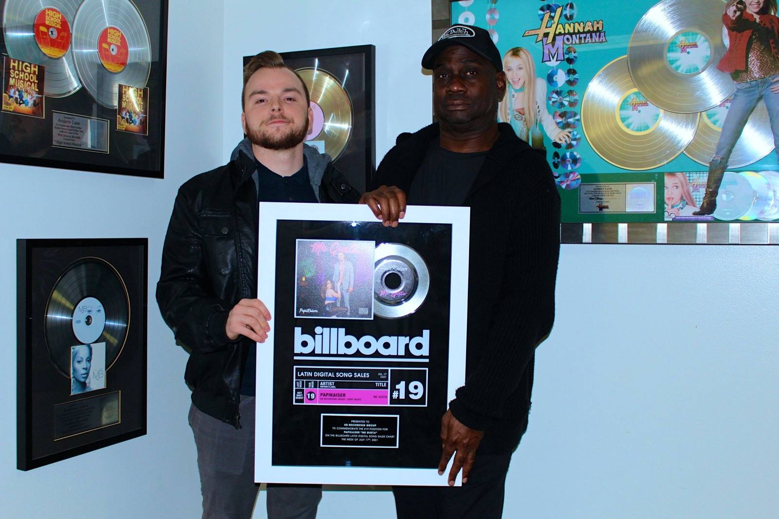 Andrew Lane and Kyle Burkett with a Billboard charting plaque